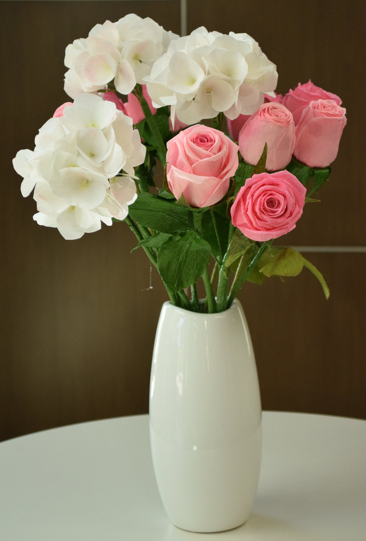 Dozen pink hybrid roses and 3 powder pink hydrangeas