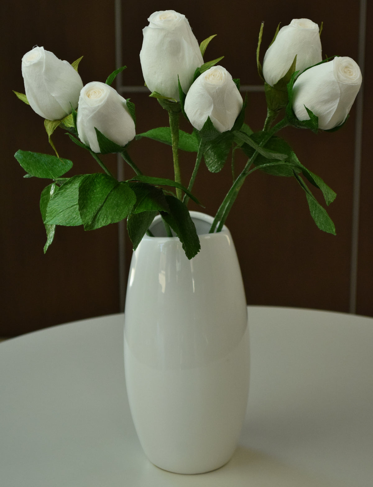 Six white hybrid roses